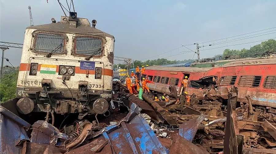 Rescue workers are digging through debris and using electric cutters to slice through the metal exterior of train compartments to reach those trapped inside